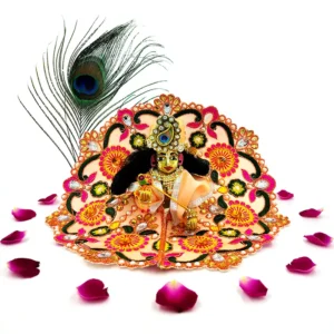 Laddu Gopal idol adorned in a handmade light peach silk dress with vibrant floral embroidery and gemstone detailing