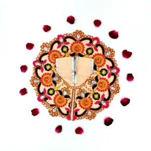 Flat lay of a light peach handmade Laddu Gopal silk dress with multicolor floral embroidery and decorative stones